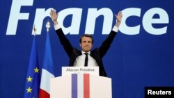  election, celebrates after partial results in the first round of 2017 French presidential election, at the Parc des Exposit