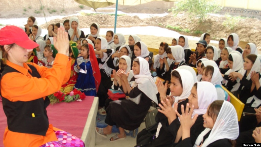An actress from the Bond Street Theatre teaches pantomime to Afghan girls.
