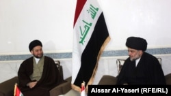 Iraq - Muqtada al-Sadr with Ammar al-Hakim during their meeting, Najaf, 23Jan2015