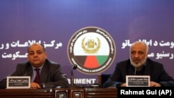 Wais Barmak (L), Afghan Interior Minister, speaks during a joint press conference with Afghan intelligence chief Masoom Stanekzai, in Kabul on February 1