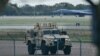 An armored vehicle patrols the RAF Fairford base in southwest England on September 28.
