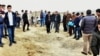 Iraqi Kurds inspect a crater reportedly caused by an Iranian missile initially fired at Iraqi bases housing U.S. and other U.S.-led coalition troops, in the Iraqi Kurdish town of Bardarash in the Dohuk governorate, January 8, 2019