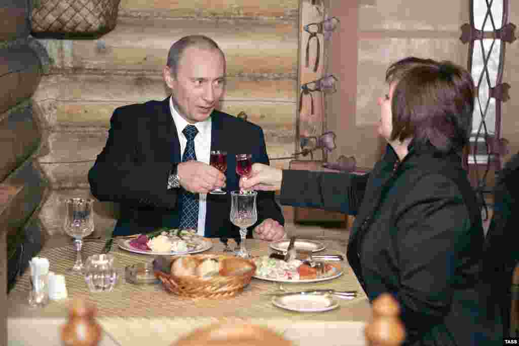 Vladimir Putin and Lyudmila dine at a restaurant serving Siberian cuisine in Moscow after voting in the Duma elections in December 2007.