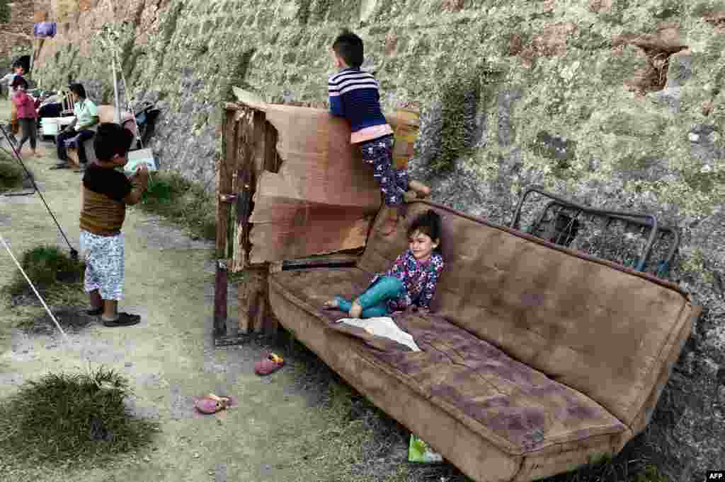 Children play in a municipality-run camp housing migrants and refugees in the city of Chios, on the Greek Aegean island of Chios. (AFP/Louisa Gouliamaki)