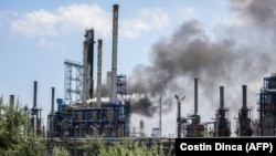 Black smoke can be seen rising from the refinery, which is in the immediate vicinity of Mamaia, the country's largest sea resort. 