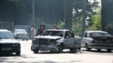 Investigators work at the scene of a bomb blast in Georgia's volatile breakaway region of Abkhazia. Much of the ethnic tensions that pervade the post-Soviet space can be attributed to Stalin-era nationalities policies. 