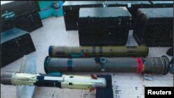 Weapons, said to be seized by Saudi-led coalition forces on an Iranian boat, are seen in an image released by the Media Office Of Saudi-led Coalition In Yemen. File photo