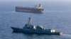 This US Navy handout photo released on May 7 by US Central Command Public Affairs shows the Arleigh Burke-class guided-missile destroyer USS Rafael Peralta implementing a maritime blockade against the Iran-flagged crude oil tanker vessel.