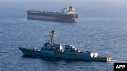 This US guided-missile destroyer Rafael Peralta implements a maritime blockade against an Iran-flagged crude oil tanker vessel. 