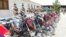 Afghan army soldiers stand behind the Taliban motorcycles they have captured in the southeastern province of Paktia.