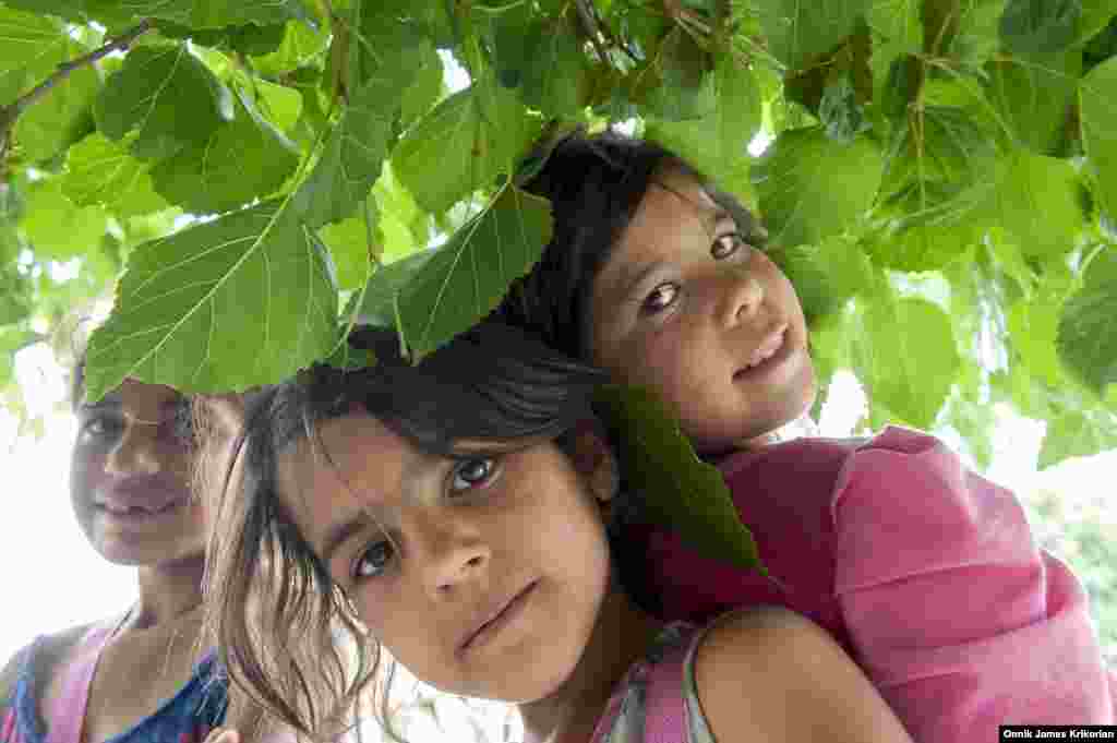 Three ethnic Kurdish street children from Azerbaijan, pose for the camera outside the Tbilisi Beer Festival held on the city&rsquo;s Rose Revolution Square. Such events offer them an opportunity to beg among large groups of people, although security guards and police try &ndash; and often fail &ndash; to keep them away.