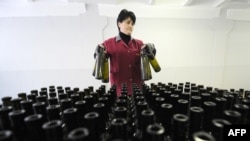 An employee stands in front of bottles at a winery in Tbilisi. (file photo)