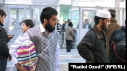 Tajik students pictured here returning from Islamic countries