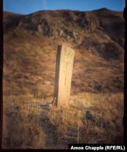 A 13th-centrury khachkar that stands around 3 meters high on a mountainside in Vayots Dzor Province. This photo shows the front side of the same monument featured at the top of this article.