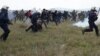 Greek police clash with migrant protesters near the North Macedonia border on April 6.