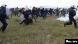 Greek police clash with migrant protesters near the North Macedonia border on April 6.