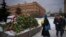 People lay flowers to pay last respects to Aleksei Navalny at the Solovetsky Stone, a monument to political repression, in Moscow on February 17. 