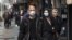 Pedestrians wearing protective masks against coronavirus (COVID-19) in Tehran, Iran. March 1, 2020.