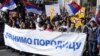 Protesters walk behind a banner reading "We Defend The Family" during a rally in the center of Belgrade on October 9 against a gay-pride parade planned for October 10.