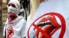 Young activists of the Freedom of the Press group wear T-shirts with their logo as they give out leaflets in Kyiv. Freedom House found a "significant decline" in press freedom in Ukraine.