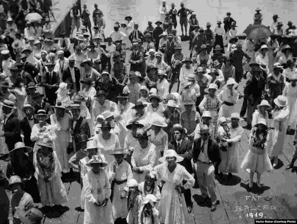 People posing at the harbor in Honolulu, Hawaii.