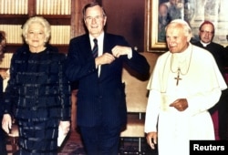 George and Barbara Bush with Pope John Paul II at the Vatican in 1989.