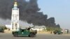 FILE: Afghan security forces at the site of a bomb attack outside the provincial police headquarters in Kandahar, July 2019.