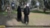 Islamic State released this image showing a woman being stoned to death for adultery after being "convicted" in a Shari'a court.