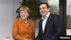 Angela Merkel i Ahmet Davutoglu u Briselu 7. marta 2016.