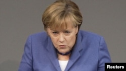 German Chancellor Angela Merkel said no EU member state would be "abandoned" if in financial distress.