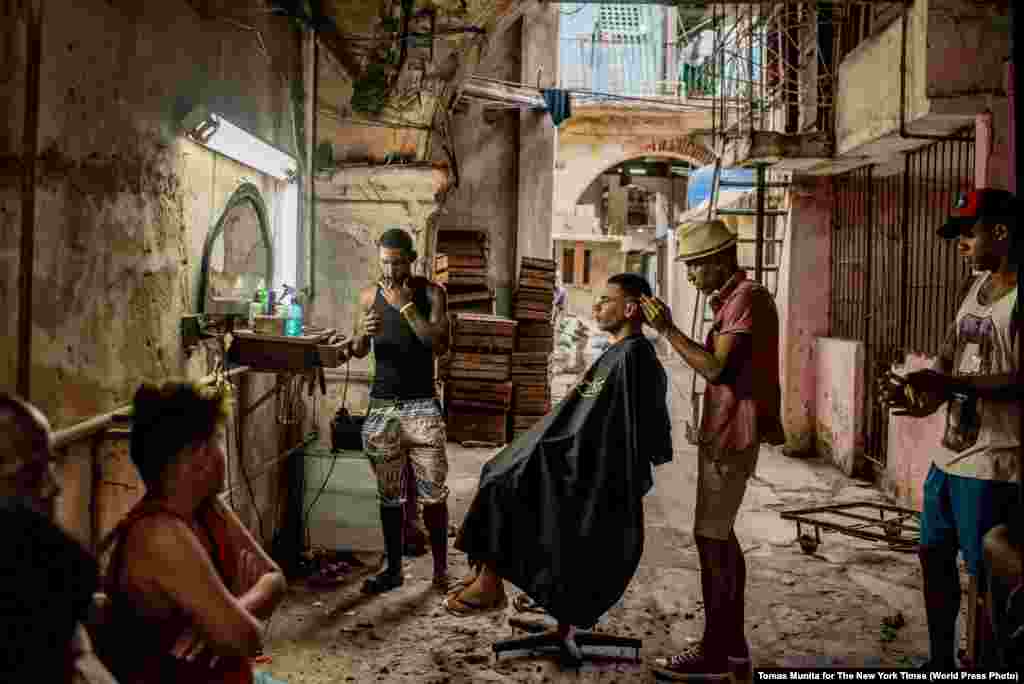 &quot;Cuba On The Edge Of Change&quot; -- A weathered barber shop in Old Havana.&nbsp; Daily Life -- First Prize, Stories (Tomas Munita, for The New York Times)