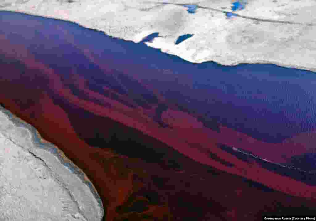 The Ambarnaya River outside Norilsk. Local rivers have been colored red by the massive fuel leak.&nbsp;