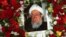 A portrait of former Afghan President Sibghatullah Mojaddedi is seen during his funeral procession at the presidential palace in Kabul on February 13.