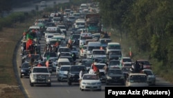 A convoy of supporters of former Pakistani Prime Minister Imran Khan heads toward Islamabad on November 24.