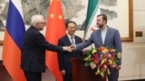 Russia's Deputy Foreign Minister Sergei Ryabkov (left), China's Executive Vice Minister of Foreign Affairs Ma Zhaoxu (center), and Iran's Deputy Foreign Minister Kazem Gharibabadi hold a press conference in Beijing, March 14