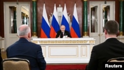 Russian President Vladimir Putin gives a statement to the media in Moscow in the early morning of May 11.