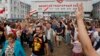 Workers leave the Minsk Wheeled Tractor Plant as opposition activists protest in Minsk on August 18.