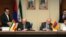 Iran - Energy Minister Hamid Chitchian (L) and his Armenian counterpart Yervand Zakharian sign a memorandum of understanding in Tehran, 16Dec2014.