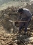 Afghanistan - Afghans clean up rubble left by Pakistani air strikes in Kunar Province on October 1 - AFP screen grab
