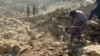 Afghanistan - Afghans clean up rubble left by Pakistani air strikes in Kunar Province on October 1 - AFP screen grab