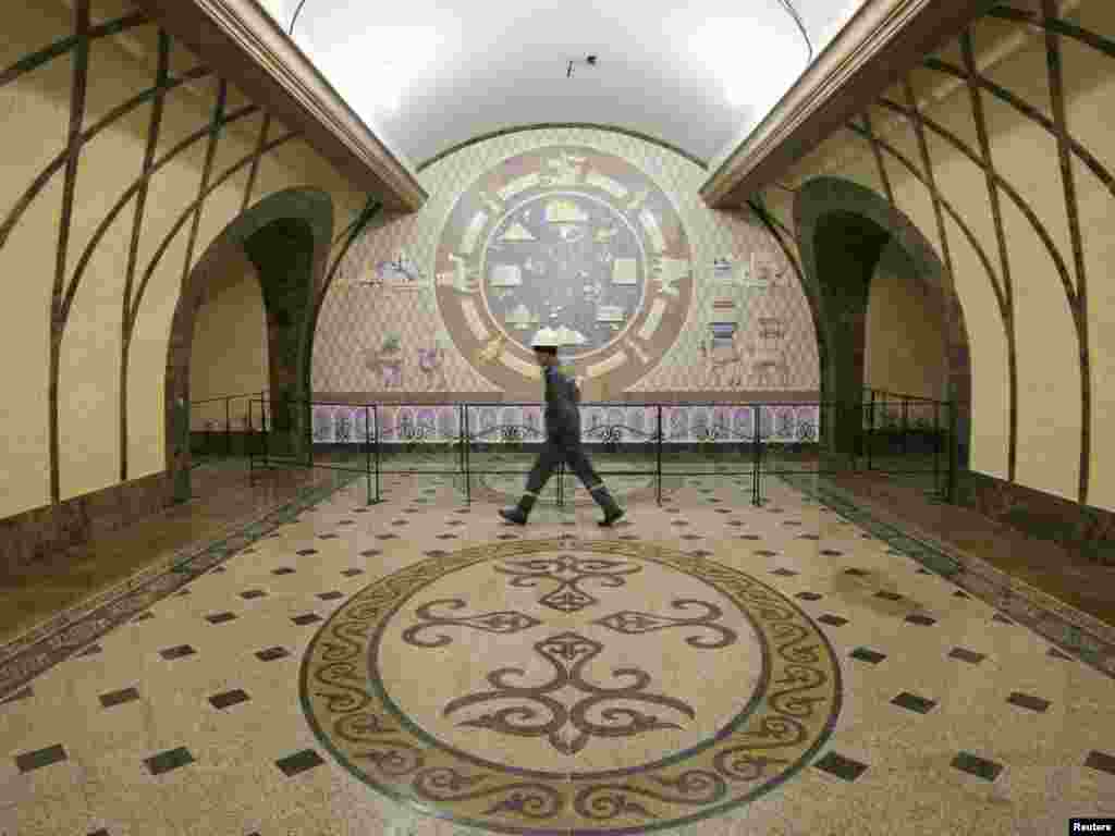 Kazakhstan -- A constructor walks along a hall of Zhybek-Zholy (Silk Way) station of the Almaty subway, 21Oct2010 - A constructor walks along a hall of Zhybek-Zholy (Silk Way) station of the Almaty subway, October 21, 2010. The construction of the Almaty underground, a project which started under the Soviet Union in 1988, is in its final stage and will be opened next year. REUTERS/Shamil Zhumatov (KAZAKHSTAN - Tags: TRANSPORT BUSINESS CONSTRUCTION) POTW42 10poty