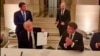 TOPSHOT - This videograb from footage made available on June 18, 2026, from the X account of French President Emmanuel Macron shows US President Donald Trump (L) and France's President Emmanuel Macron (R) during the signing of a deal with Iran to end the Middle East war, inside Chateau de Versailles, in Versailles southwest of Paris on June 17, 2026. (Photo by @EmmanuelMacron (X account of France's President Emmanuel Macron) / AFP) / NO USE AFTER JULY 17, 2026 22:00:00 GMT - XGTY - RESTRICTED TO EDITORIAL USE - MANDATORY CREDIT «  AFP PHOTO / @EMMANUELMACRON » - NO MARKETING NO ADVERTISING CAMPAIGNS - DISTRIBUTED AS A SERVICE TO CLIENTS - NO ARCHIVE