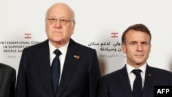 Lebanon's caretaker prime minister, Najib Mikati, met with French President Emmanuel Macron at an international press conference in support of Lebanon in Paris on October 24.