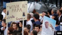 Believers arrive to take part in the Holy Mass that will be held in Tirana, Albania, on September 21. 