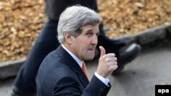 U.S. Secretary of State John Kerry gives a thumbs up after a bilateral meeting with Iranian Foreign Minister Mohammad Javad Zarif during a new round of nuclear talks in Montreux on March 4.