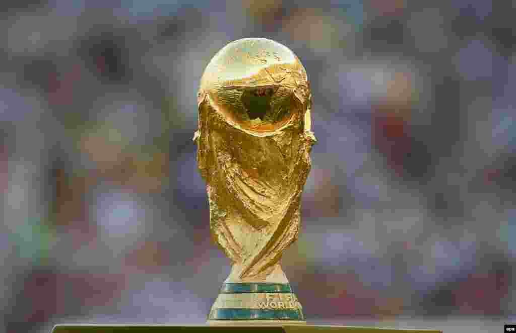 BRAZIL SOCCER FIFA WORLD CUP 2014 -- The World Cup trophy is displayed before the FIFA World Cup 2014 final between Germany and Argentina at the Estadio do Maracana in Rio de Janeiro, Brazil, 13 July 2014. 