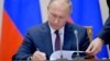 Putin Signs Law Allowing Voting By Mail And Internet