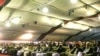 Afghan delegates at a previous Loya Jirga, or grand assembly, listen to a speech by Afghan President Hamid Karzai at that June 2010 event.