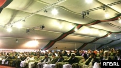 Afghan delegates at a previous Loya Jirga, or grand assembly, listen to a speech by Afghan President Hamid Karzai at that June 2010 event.