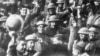 Men of U.S. 64th Regiment, 7th Infantry Division, celebrate the news of the Armistice